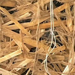 Straw fill with jute netting for an erosion control blanket