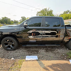 A Dodge Ram pickup truck looking pristine with a freshly applied ceramic coating, highlighting the smooth, protected paint surface achieved through professional detailing