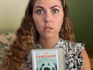 Books with Brittani holds her kobo eReader, which shows the book cover of Marcus Kliewer's "The Caretaker"