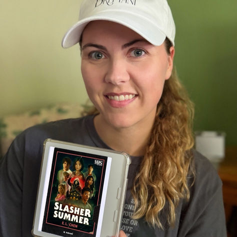 Books with Brittani holds her Kobo eReader that shows the book cover of E. L. Chen's "Slasher Summer"