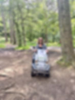 Carrie-Ann using the Tramper on the forest path