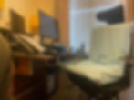 The enora air seat on a desk chair by a computer