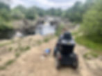 Carrie-Ann and her dog Poppy from the back looking at the Low Force waterfall