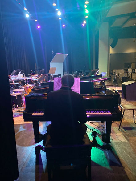 Strike a chord. Jackson Feeney (12) plays a tune on the piano thirty minutes before the concert starts. The 2025 winter band concert opened its doors at 6:30pm on January 10th after it was rescheduled after a winter storm in December.