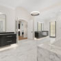 Designing a Luxury Primary Bathroom: Stone, Steam, and Serenity