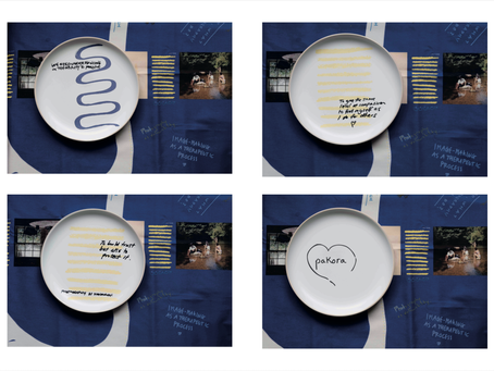 Four ceramic plates featuring handwritten reflections and symbolic markings placed on a deep blue illustrated tablecloth during Becky Warnock’s socially engaged photography and creative dialogue project, Finding Your People, part of Medway Lens 2026.