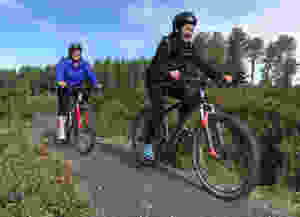 women riding their bikes off-road