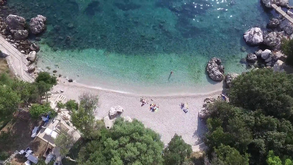 Aerial view of Soline beach with clear water and trees. Villa Soline