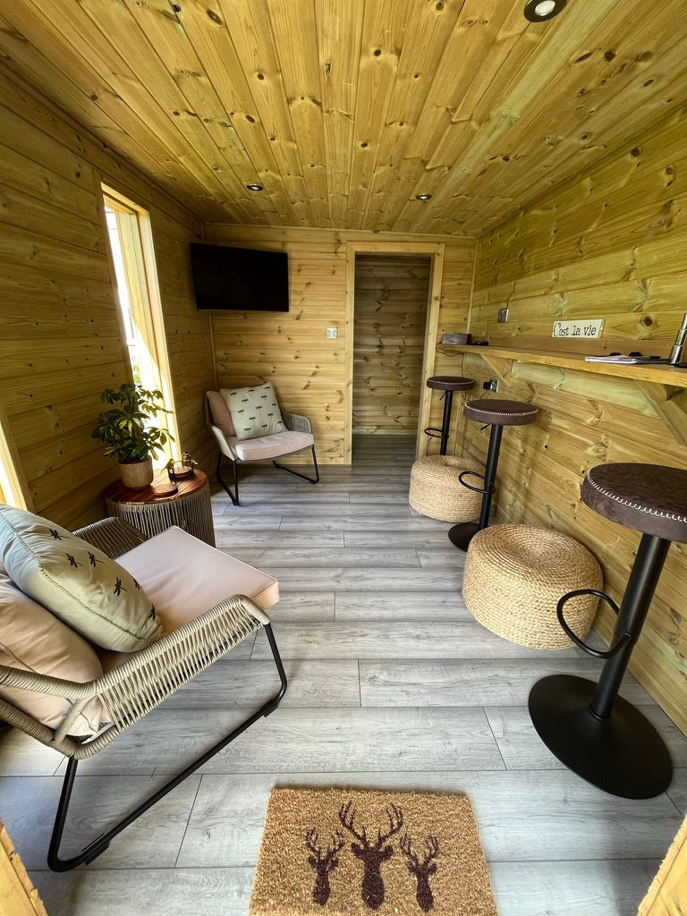 Inside of fully insulated garden room, showcasing the lounge area