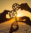 Four hands collect the gear from the gears of the details of the puzzles. against the back