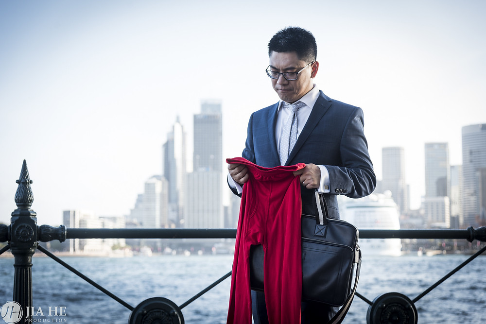 He is missing his families in China when staring at his red long john pants at the seaside of Sydney