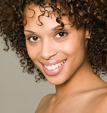 Smiling Woman After Receiving Restorative Dental Services