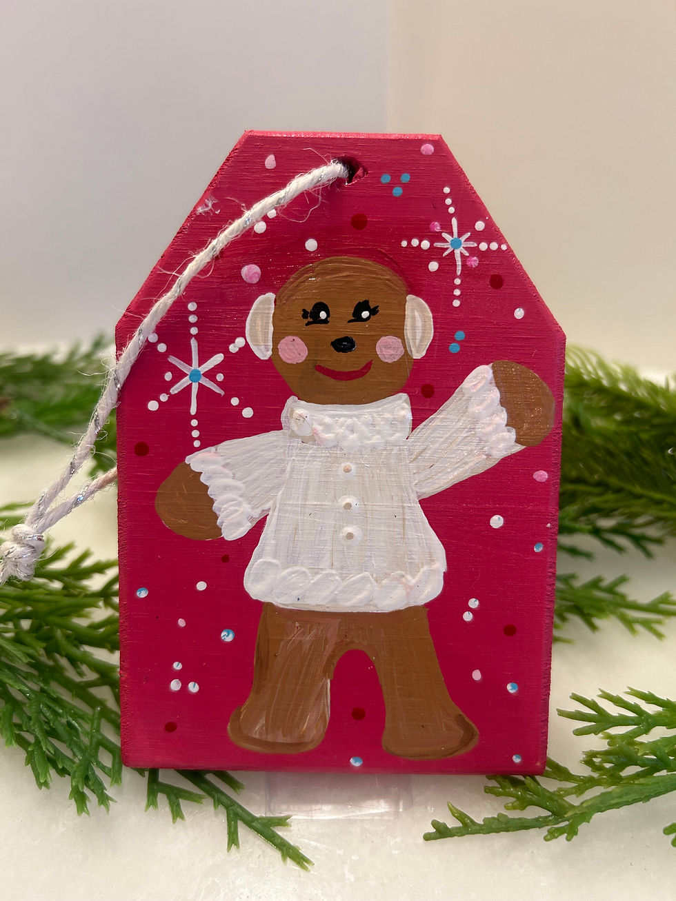 Gingerbread boy in sweater on red