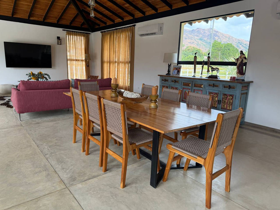 Dining area with wooden table and chairs.