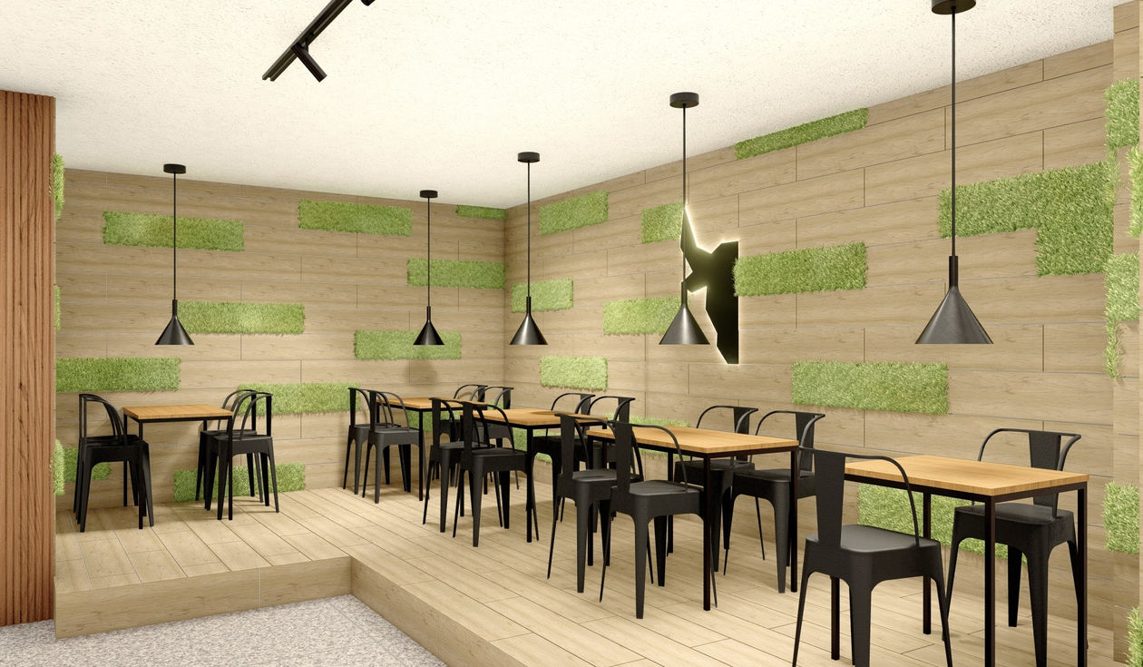 Modern cafe interior with green accents and pendant lights.