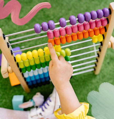 kids counting on an abacus toy