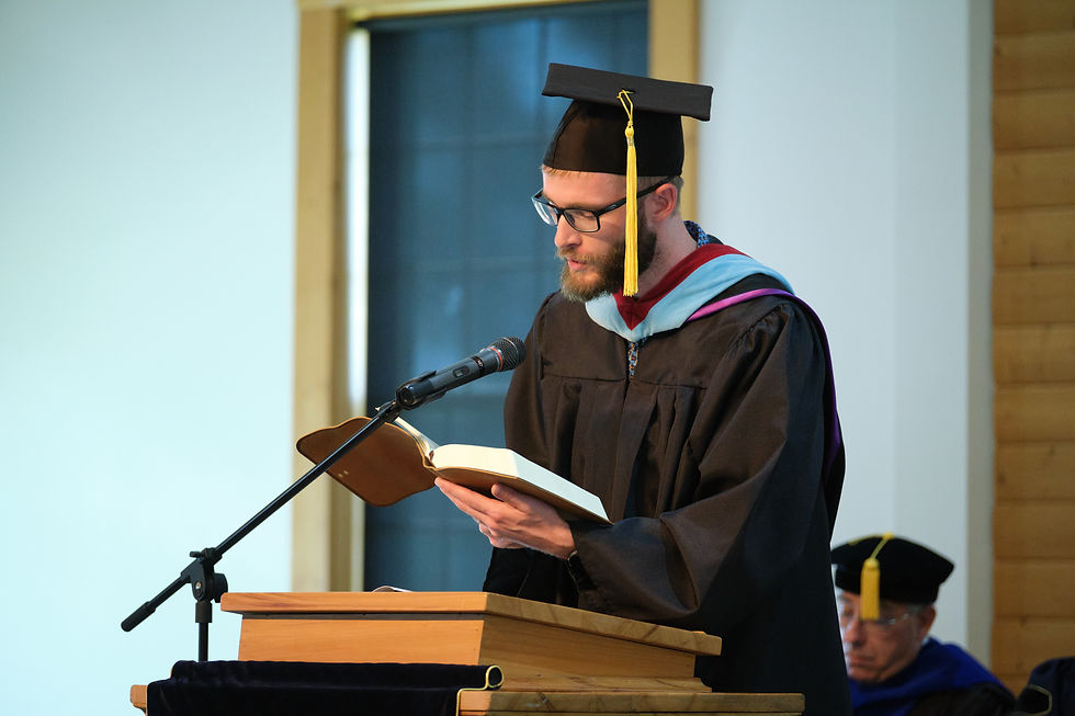 Montana Bible College Dean of Students & Discipleship Carter Knight reads John 1:1-5, 9-14 at the Investiture of President Joe King on Sept. 6, 2025.