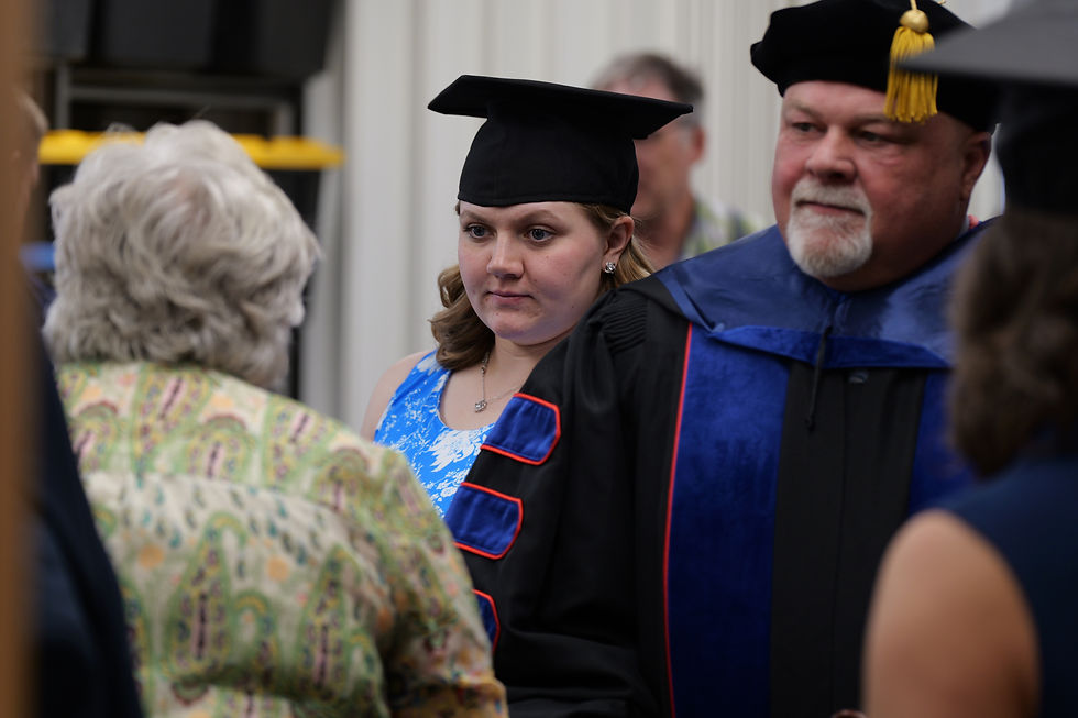 Kaitlynne Hanson, center, gets ready for her 2026 graduation from Montana Bible College on May 2 at Phillips Chapel.