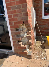 Damaged brickwork in Diss before repair and rebuild