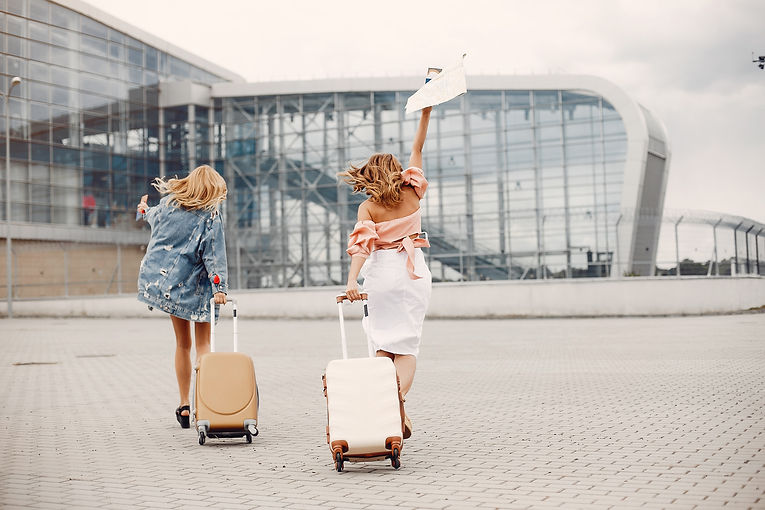two-beautiful-girls-standing-by-the-airp