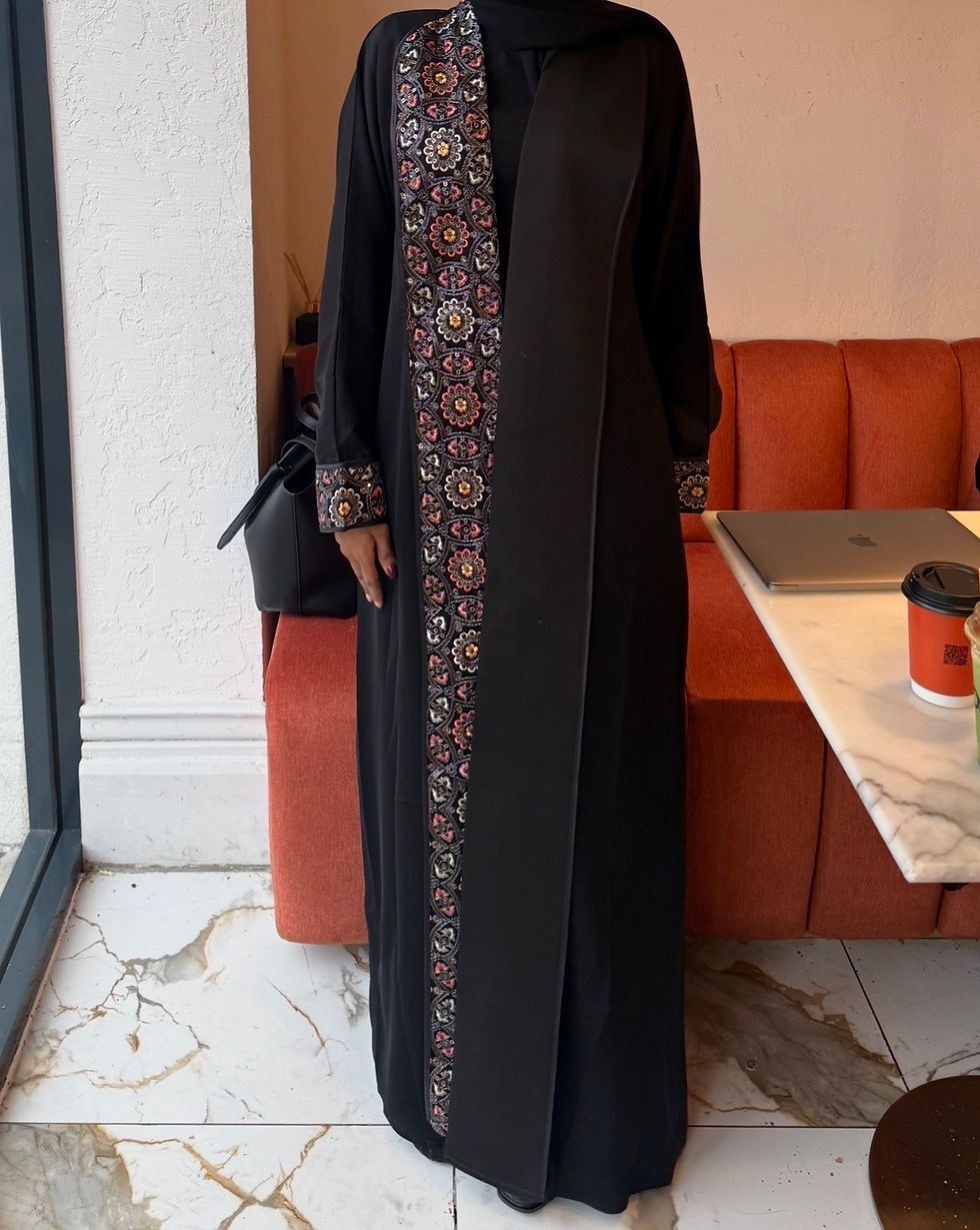 Thumbnail: Abaya designed with subtle asymmetrical orange detailing