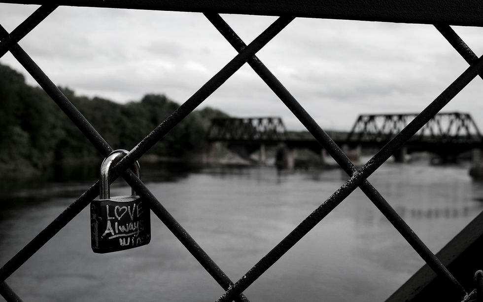 A padlock with the words love always wins written on it