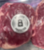 Meat in supermarket with security protected sticker