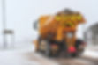 Road gritting lorry in snowy conditions