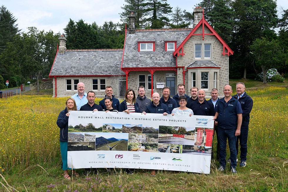 The project team mark the completion of the restoration work outside the Superintendent’s House at Silent Valley