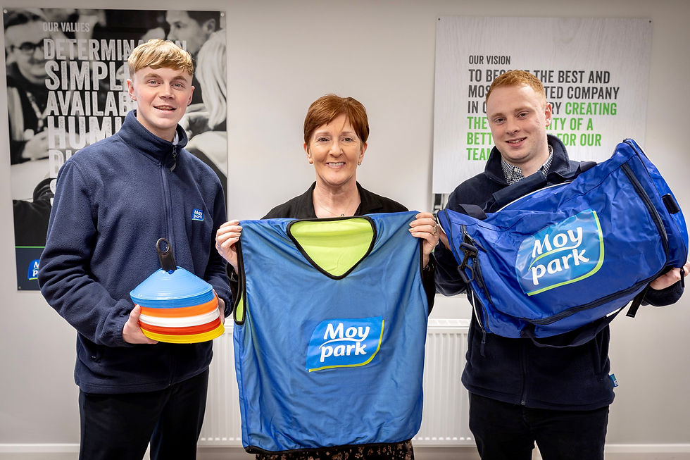 Ben Stevenson (L) and Robin Moore (R) from Moy Park pictured with Sandra Sherran from Ballykeel Primary School.