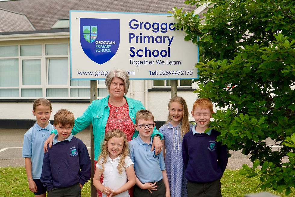 Catherine Humphrey, Principal of Groggan Primary School pictured with some of the pupils.