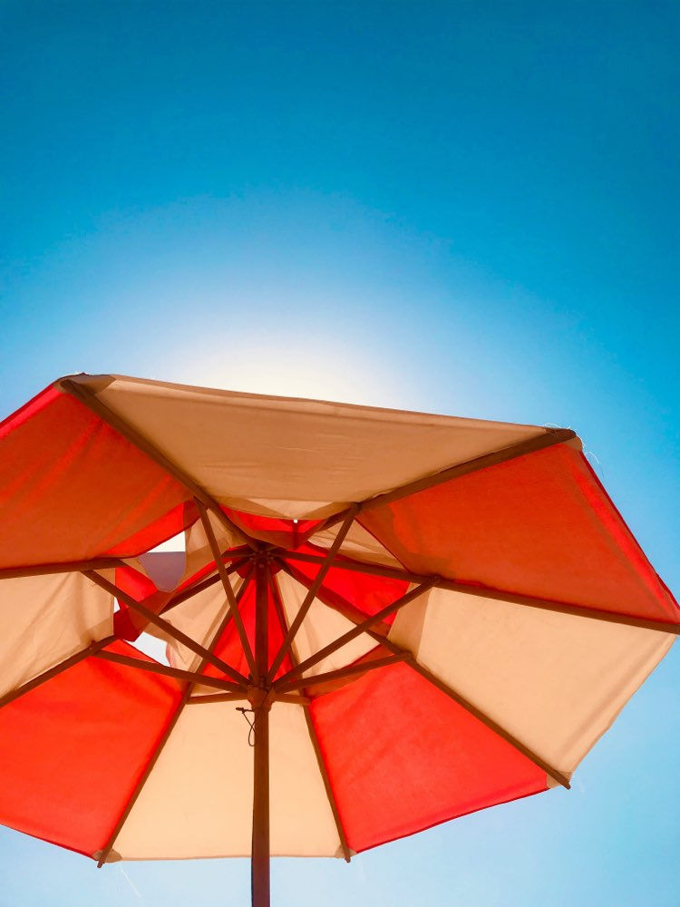 Sun umbrella against a blue sky