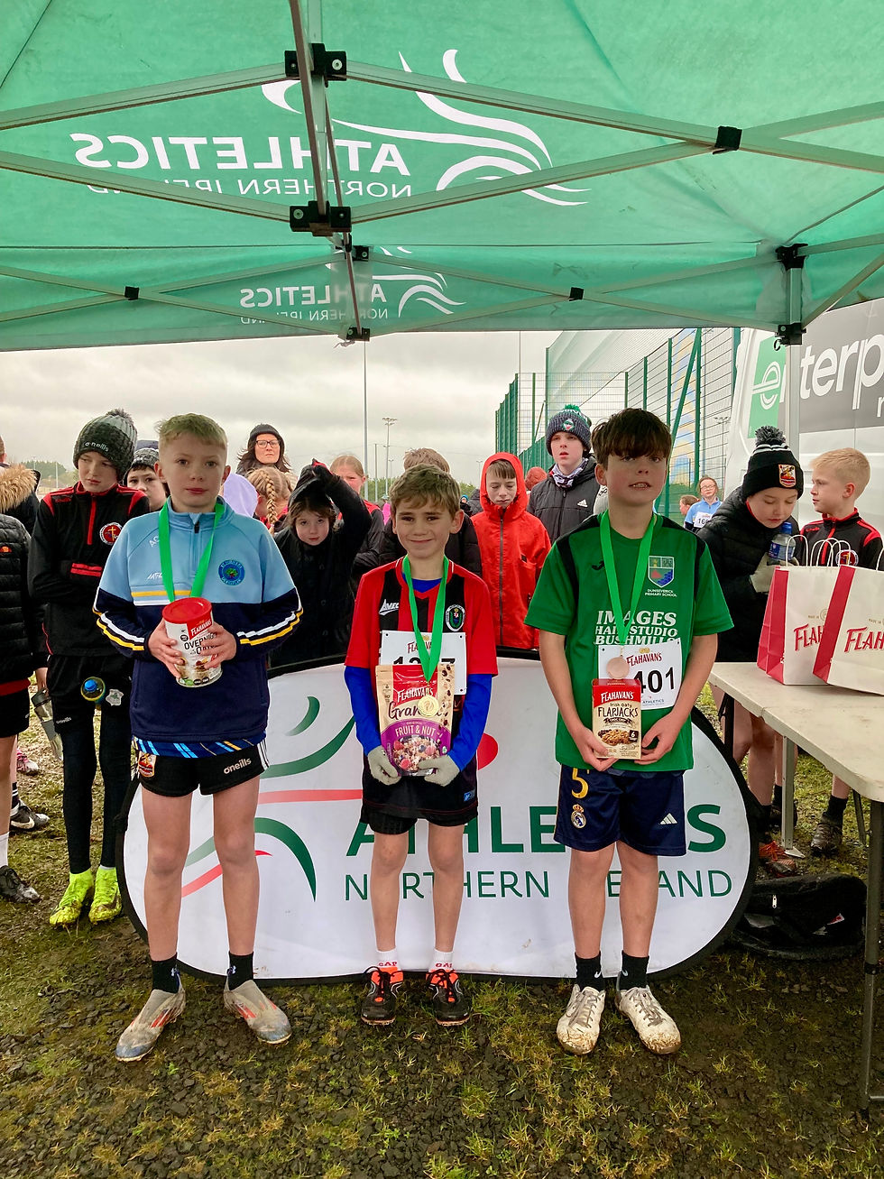 Aidan Colgan from St John’s Primary School, Dernaflew in 2nd place, Jackson Nellins from D.H. Christie Memorial Primary School, Coleraine in 1st place and Sean Bustard from Dunseverick Primary School, Bushmills in 3rd place in the boys’ race at the second round of the 2024-2025 Flahavan’s Athletics NI Primary School Cross Country League which took place at the Joey Dunlop Leisure Centre.