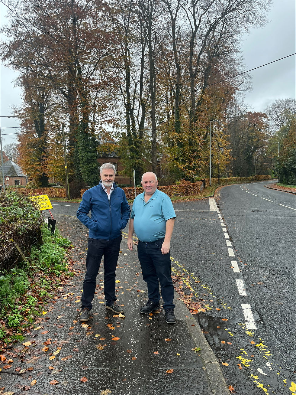 DUP North Antrim MLA Paul Frew, and Councillor Reuben Glover at the junction of Dans Road and Galgorm Road