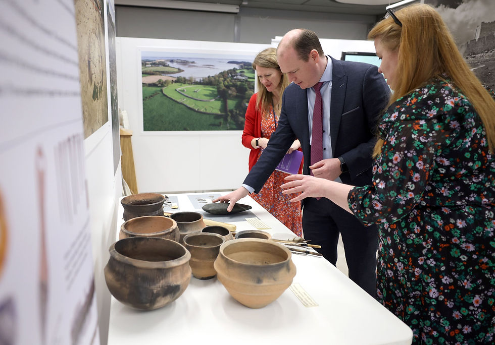 Communities Minister Gordon Lyons examines some of the HERoNI artifacts on exhibit at PRONI.