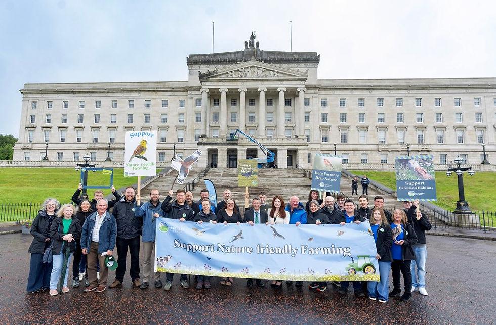 Supporters outside Stormont calling for long-term investment in agri-environment schemes to support farmers and restore wildlife, pictured with DAERA Minister Andrew Muir