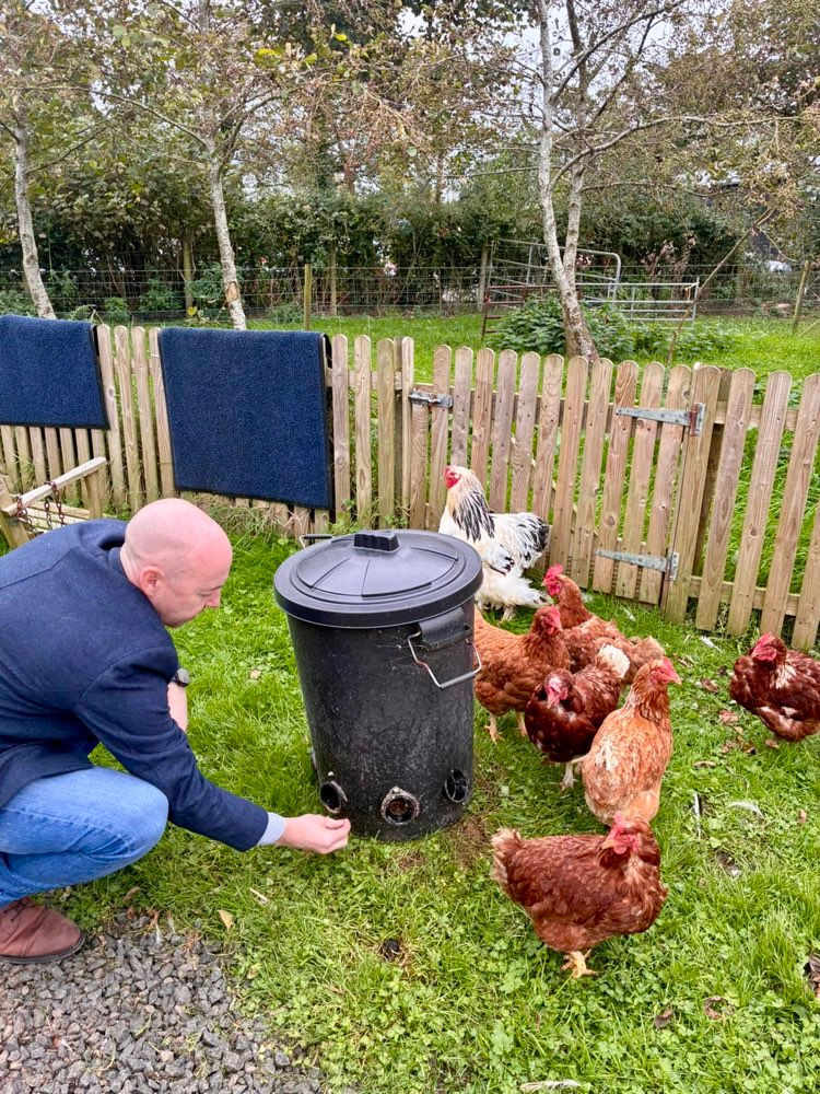 Jon Burrows MLA discovering the pleasures of tending poultry