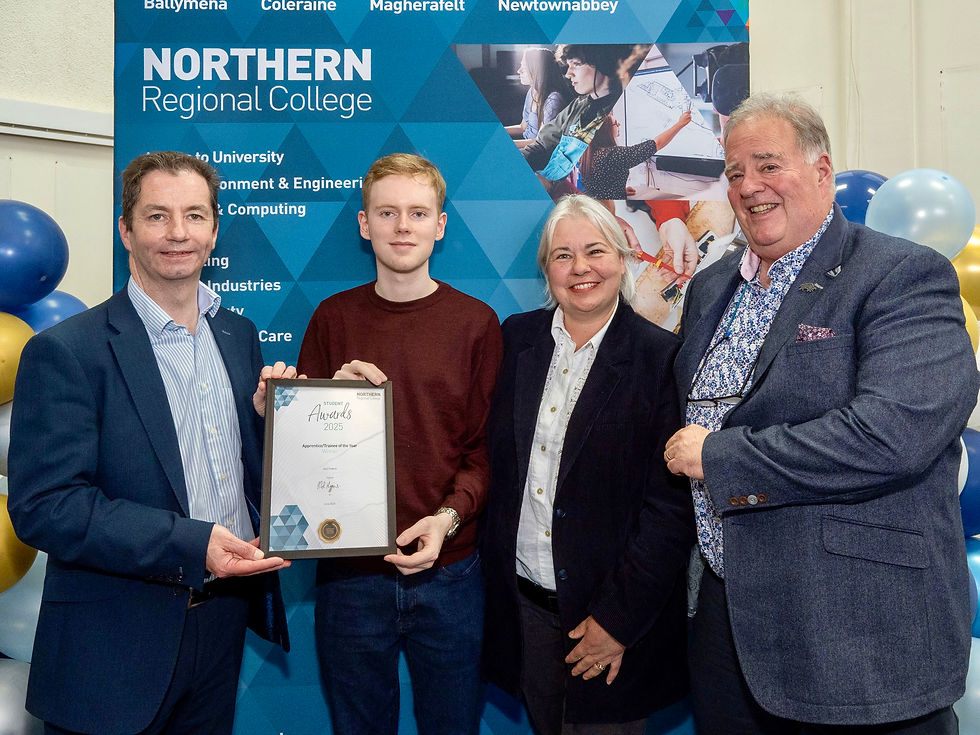 Jack Pollock, winner of the Apprentice/Trainee of the Year - FdSc Computing award, pictured with his Father David and Mother Caterina and Mel Higgins, Principal & Chief Executive of Northern Regional College.