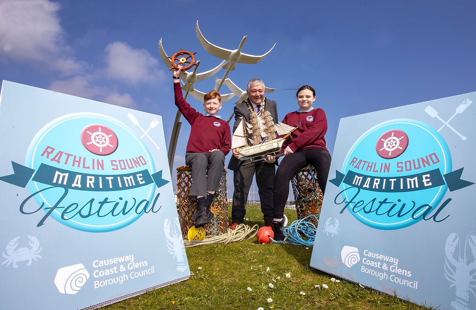 Mayor of Causeway Coast and Glens, Councillor Ivor Wallace with Riley Morris and Maia Kinney, Head Boy and Head Girl of Ballycastle Integrated PS, at the launch of Rathlin Sound Maritime Festival 2023.