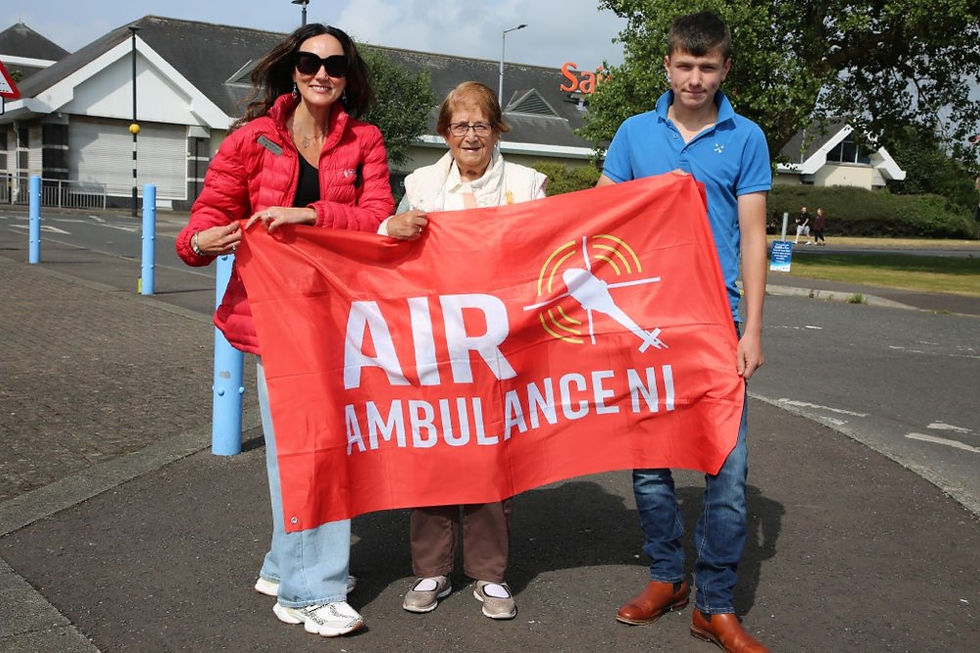 Kerry Anderson (Head of Fundraising Air Ambulance NI), Jean Penney, Tristan Penney (Jean’s Grandson).