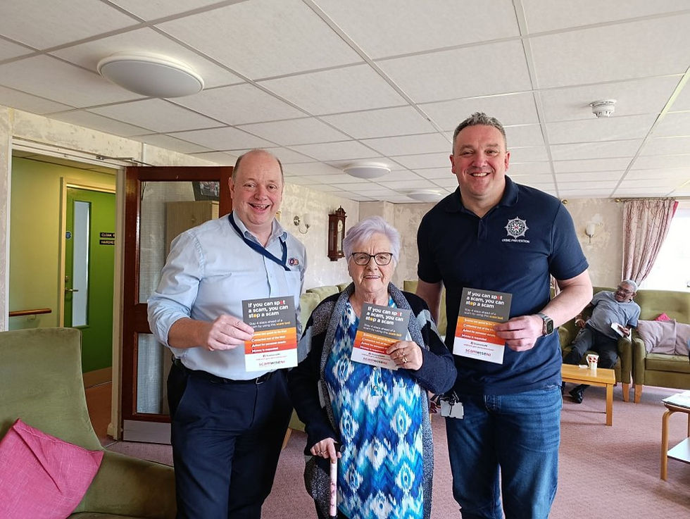 Andrew, Ballymena Rural Warden; a resident of Cullybackey Fold and Paul, PSNI Crime Prevention Officer educate senior citizens on scams.