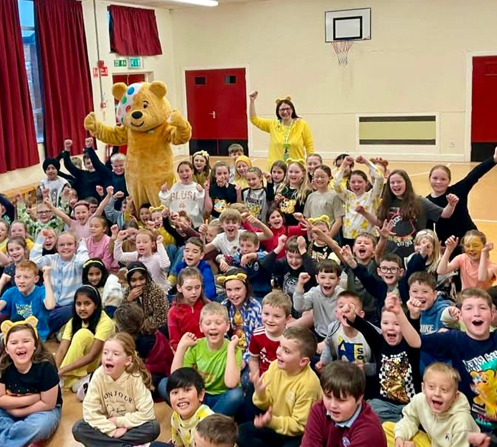 Pudsey and Asda Antrim's Ashley Ritchie visited local schools in aid of BBC Children in Need