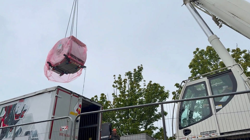 The new MRI scanner arriving at the Causeway Hospital being lifted by crane