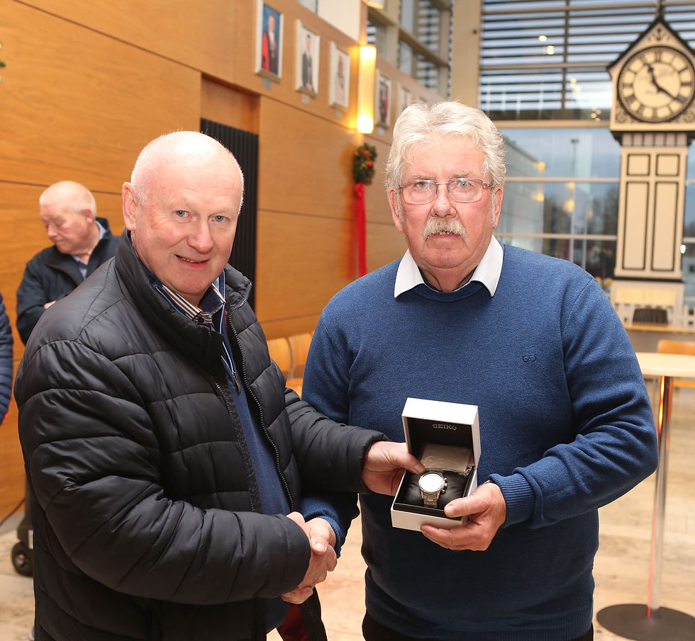 Local photographer David McIntyre who was recognised at a recent Mayors reception, pictured here with Mervyn White as he is presented with a gift.