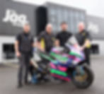 The Essence Vault is set to sponsor the Open Race at this year’s Armoy Road Races. Pictured at the firm’s headquarters in Randalstown are, from left, Neil Kernohan, road racer, Bill Kennedy MBE, AMRRC Director, Connor Martin, The Essence Vault Managing Director and William Munnis, AMRRC Clerk of Course.
