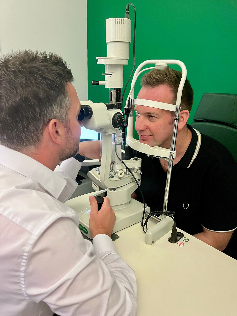 Philip Campbell with optometrist Darren Caulfield of Specsavers Larne