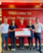 The Ballee Pharmacy team present a cheque to Air Ambulance NI. Pictured are Pharmicist partner Stephen Burns, Lauren, Zillah - Air Ambulance NI, Nina, and Pharmacist Andrew McCaughan.