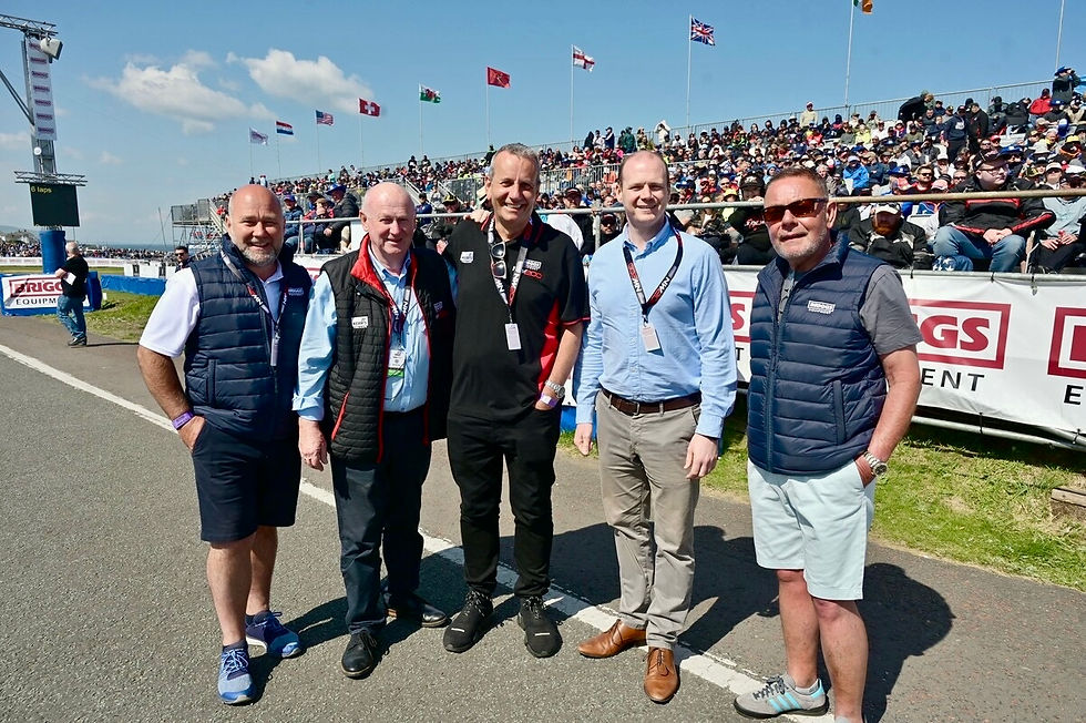 Communities Minister Gordon Lyons pictured with Mervyn White, Director of the North West 200 and representatives from Briggs Equipment Ireland, title sponsor of the North West 200.