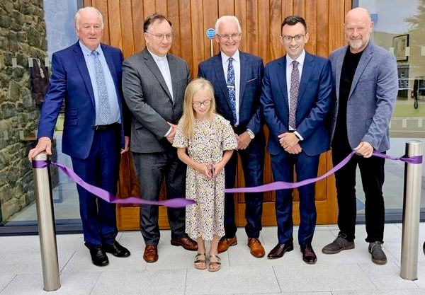 Eva Kennedy cutting the ribbon alongside (left to right) David Hamilton of Martin and Hamilton, Dr Gribben, Wilnor Reid, Clerk of Session, Rev Stephen Kennedy and Paul Griffith of MV Architects