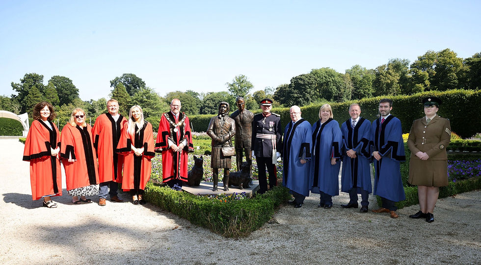 The Lord-Lieutenant of County Antrim, Mr David McCorkell KStJ and Deputy Mayor, Councillor Paul Dunlop BEM are joined by Aldermen and Councillors to unveil the sculpture of Queen Elizabeth II at Antrim Castle Gardens